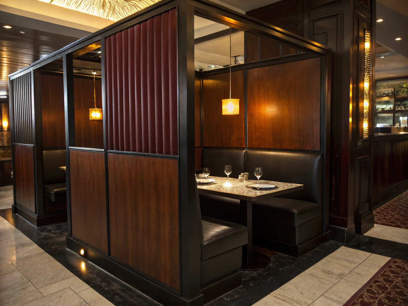 Intimate leather booth corner with warm mood lighting